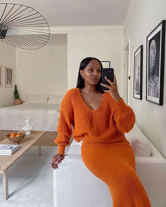 a bold orange chunky knit set with an oversized jumper and a pencil skirt is a bright and cool idea to try