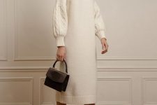 06 a gorgeous creamy midi sweater dress with long patterned sleeves, a high neckline, white booties and a black bag for an elegant look