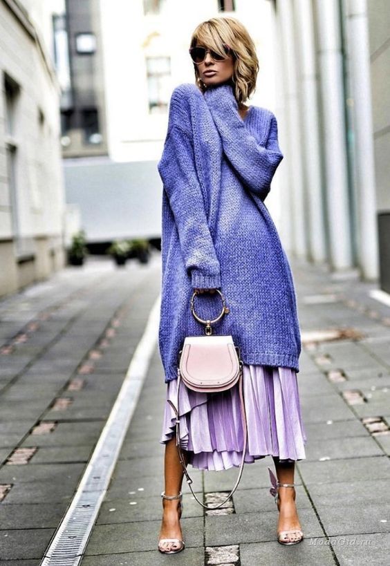 a purple midi sweater dress with long sleeves paired with a lilac pleated midi for a catchier look, a blush bag and silver shoes