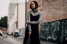 09 a chic winter work look with a grey turtleneck, a black slip midi dress, black heels and a cool bag is amazing