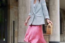 11 a catchy spring work look with a white t-shirt, a grey oversized blazer, a pink slip midi skirt, white booties and a wooden bag