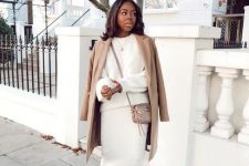 12 a gorgeous and luxurious look with a creamy co-ord set with a midi skirt and a jumper, a tan coat, lace up shoes and a tan bag
