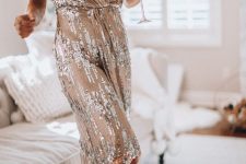 12 a tan and silver sequin midi dress with a V-neckline, short sleeves is a creative and bold idea to go for