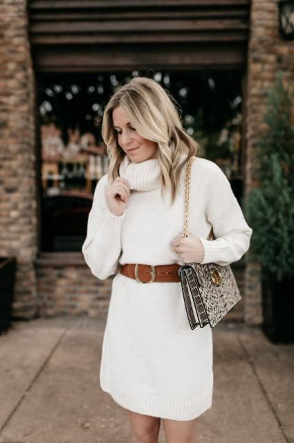 a delicate neutral mini sweater dress with a brown belt, a snakeskin print bag on chain for a lovely holiday look