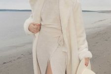 13 a jaw-dropping winter look with a creamy jumper and wrap skirt co-ord, a matching faux fur coat and a hat