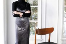 15 a black turtleneck, a silver slip dress, black tall boots for a monochromatic and shiny look