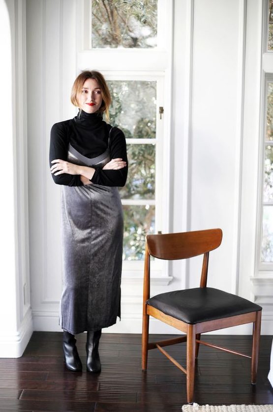 a black turtleneck, a silver slip dress, black tall boots for a monochromatic and shiny look