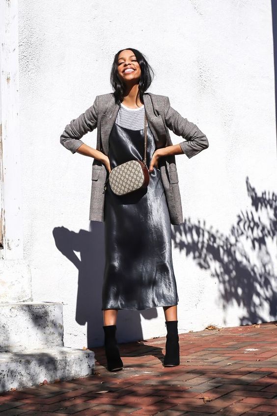 a chic spring or fall work look with a striped tee, a grey slip midi dress, a grey plaid oversized blazer, black boots and a printed bag