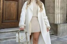 16 a neutral winter outfit with a tan knit suit – a turtleneck and a mini skirt, a creamy coat and a bag, white boots