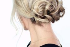 17 a braided low updo with some volume on top and some locks down is a chic and cool idea for any holiday party