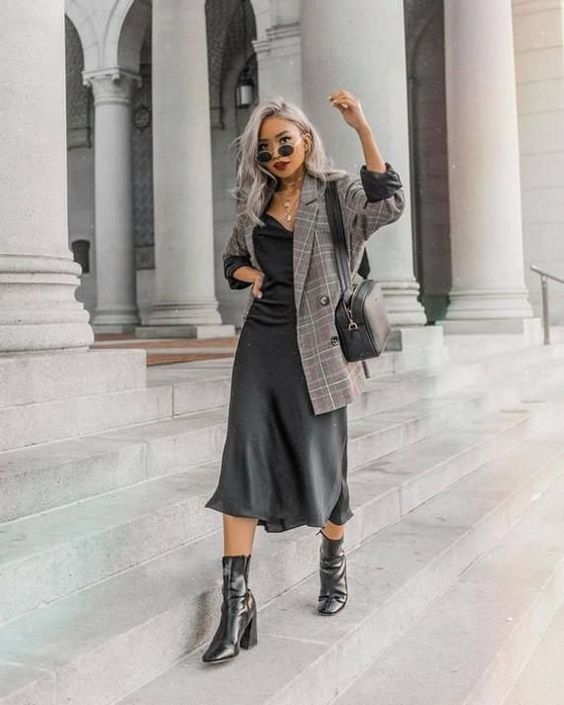 a fall work outfit with a black slip midi dress, a grey plaid oversized blazer, black boots and a bag