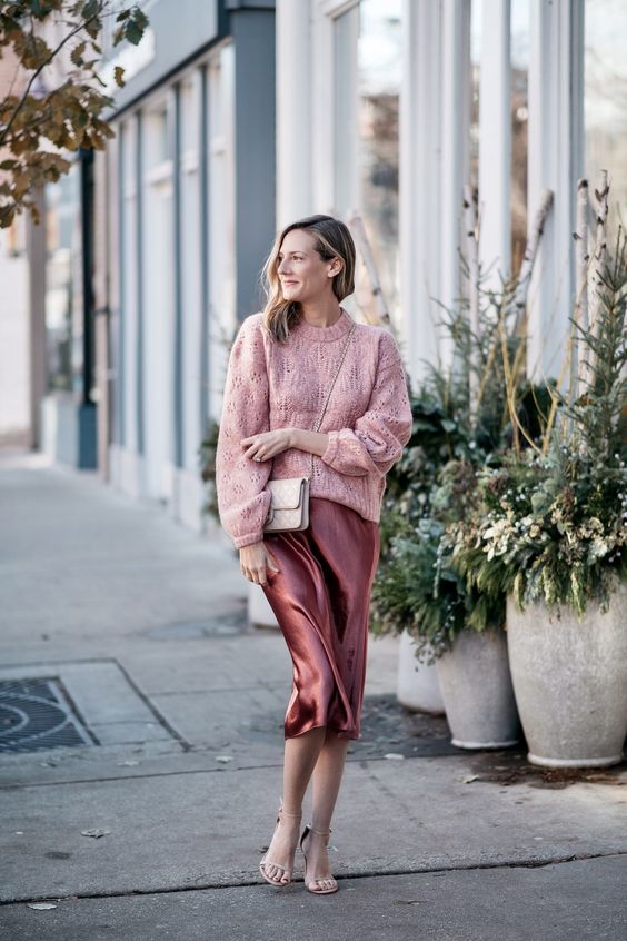 a chic work look with a girlish feel - a pink sweater, a mauve slip midi dress, silver shoes and a neutral quilted bag