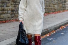 19 a neutral sweater mini dress, red knee boots, a black bag plus statement earrings for the holidays
