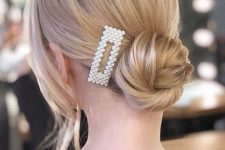 20 a delicate twisted low bun accented with a pearl hair clip is a lovely and chic idea for a holiday party of any kind