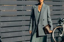 22 a refined spring work look with a green maxi slip dress, a grey oversized blazer, nude shoes and a printed bag