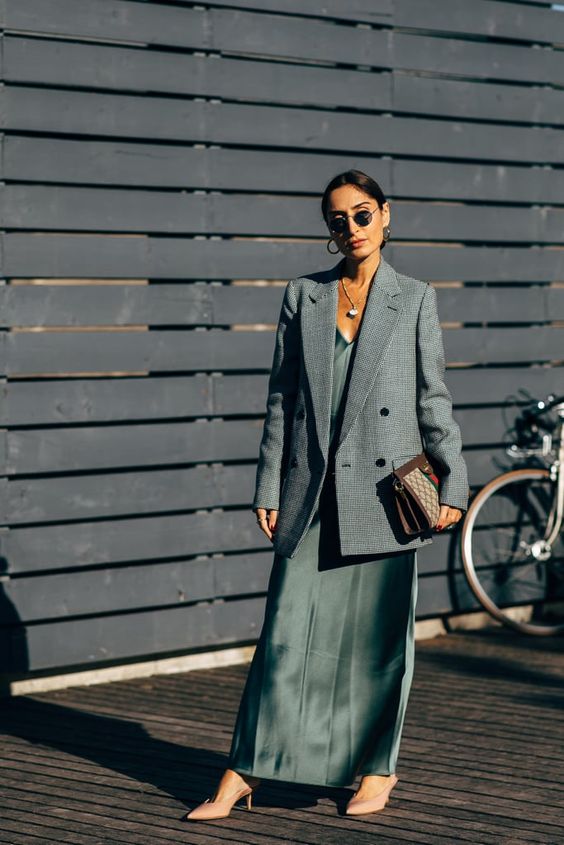 a refined spring work look with a green maxi slip dress, a grey oversized blazer, nude shoes and a printed bag