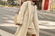 23 a white knee sweater dress, tan lace up boots, a white faux fur midi coat, a neutral bag for a chic look