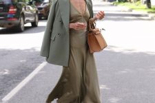 24 a fall work look with an olive green slip midi dress, a green blazer, nude shoes, a tan tote is chic