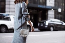24 a simple and pretty grey ribbed knit co-ord with a back slit on the skirt and an oversized sweater, white sneakers and a white bag
