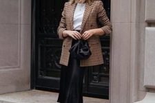 25 a work outfit with a white tee, a plaid oversized blazer, a black slip midi, black booties
