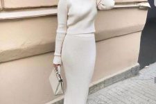 27 a refined and chic creamy sweater set with a midi pencil skirt, white shoes and a small bag plus pearl earrings