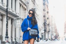 27 an electric blue sweater mini dress, matching velvet over the knee boots and a grey bag to stand out