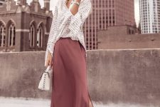 32 a work outfit with a striped shirt, a mauve slip skirt, silver heels and a white bag for spring