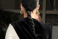 33 a twisted low ponytail is a fresh take on a usual one, use gel to get a smooth and shiny rope plait