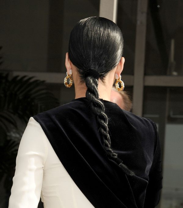 a twisted low ponytail is a fresh take on a usual one, use gel to get a smooth and shiny rope plait