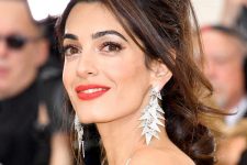 34 Amal Clooney rocking a tousled ponytail with curls and locks down and with slightly teased roots