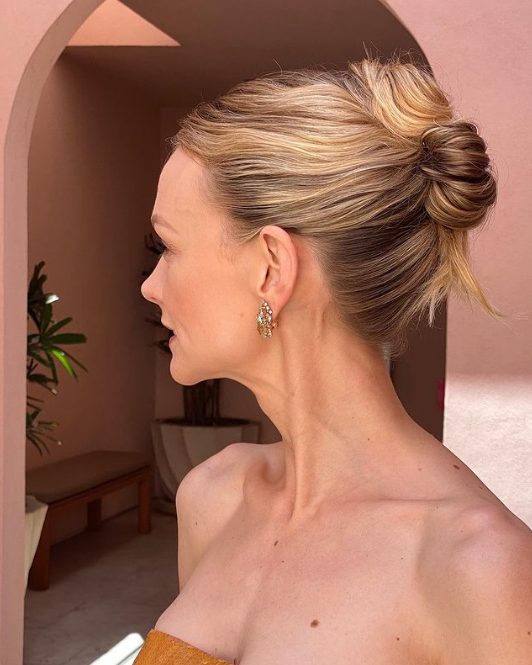 An elegant and effortless French twist updo with a wavy top is a lovely idea for a refined holiday look