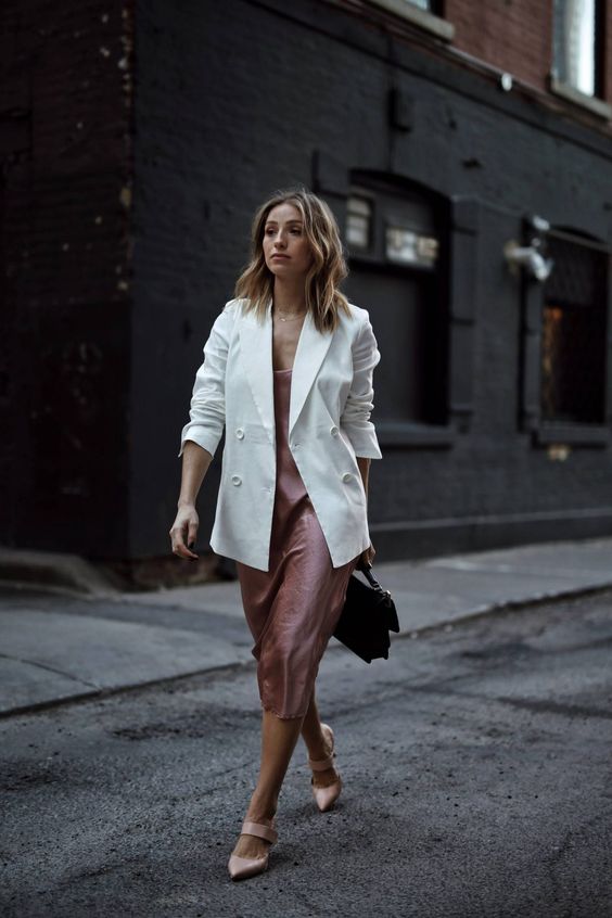 a refined summer work look with a pink slip midi dress, a white blazer, blush shoes and a black bag is wow