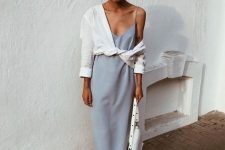 37 a simple and chic work outfit for summer, with a periwinkle slip midi dress, white slipper mules, a white linen shirt and a white bag