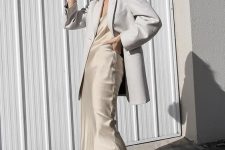 39 a summer work look with a neutral slip midi dress, an off-white oversized blazer, white trainers is effortlessly chic and comfy