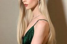 Anya Taylor-Joy wearing beautiful long locks done in creamy blonde, with a bit of curly tips looks just jaw-dropping