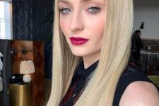 Sophie Turner wearing creamy blonde long hair for a soft and chic look, a perfect warm tone of blonde