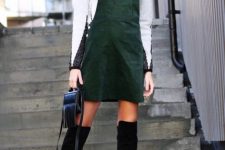 With black leather fringe bag and black suede over the knee boots
