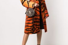 With brown knee-length dress, animal printed belted midi coat and black and brown printed ankle strap high heels