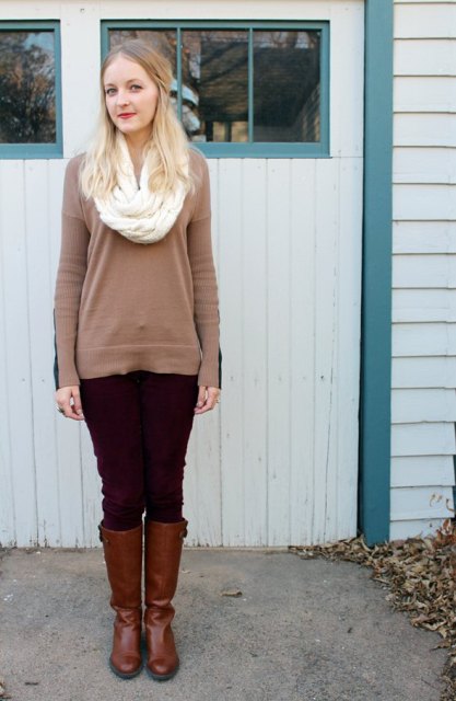 With brown long sweater, brown leather high boots and dark brown suede pants