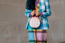 With colorful shirt, light blue and white plaid blazer, light blue, yellow, pale pink and brown checked maxi skirt and yellow checked low heeled mules