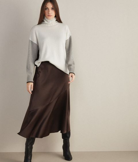 With dark brown midi skirt and black leather high boots