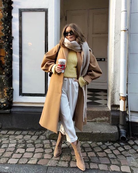 With light yellow sweater, gray fringe scarf, sunglasses, white cuffed culottes, black bag and beige suede mid calf boots