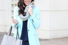 With navy blue blouse, white skinny pants, blazer and light gray leather tote bag