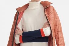 With orange skirt and pastel colored puffer jacket