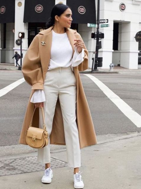 With white long sleeved shirt, beige high-waisted cropped pants, light brown leather bag and white sneakers