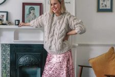 a light grey chunky sweater with a pattern, a pink sequin midi skirt, silver glitter heels for the holidays