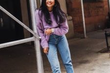 a periwinkle sweater, blue mom jeans, black pointed toe shoes and hoop earrings