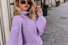 a pretty perinwinkle chunky knit sweater, black jeans are all you need for a bold winter outfit