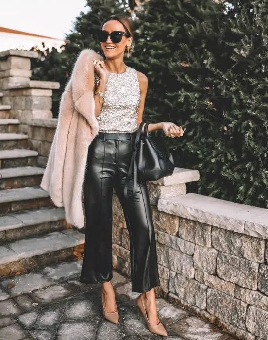 a silver sequin sleeveless top, black leather trousers and a neutral faux fur jacket for the holidays