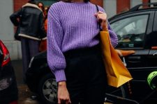 a stylish outfit with black high waisted trousers, a periwinkle chunky knit jumper, a yellow tote and a navy mini bag